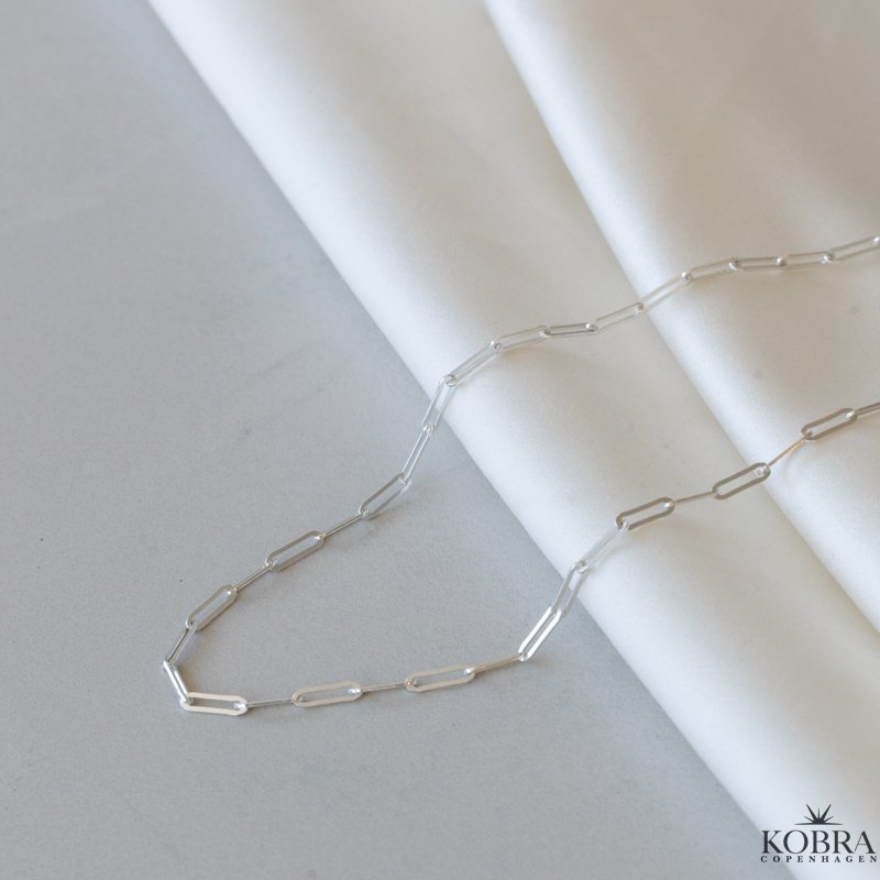 "Quinn" kde i slv eller guld