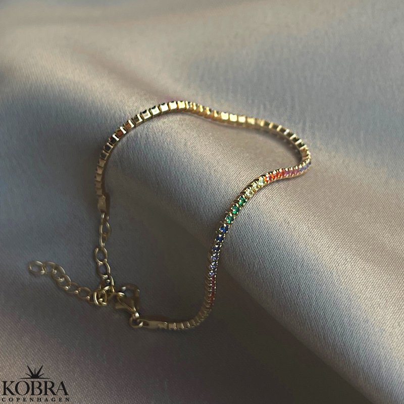 "Spring" armbnd med multifarvet sten i forgyldt