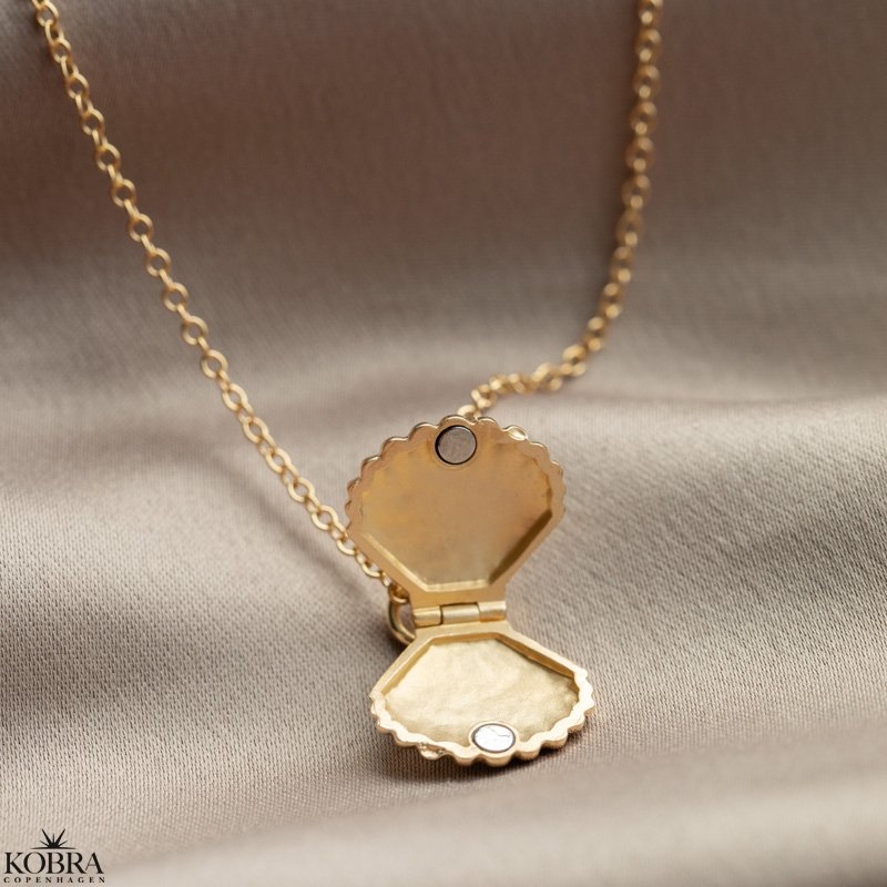  "Shiela" gold locket shaped like a clam