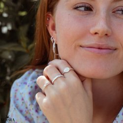 "Kaitlyn" silver ring with small hearts and a white stone