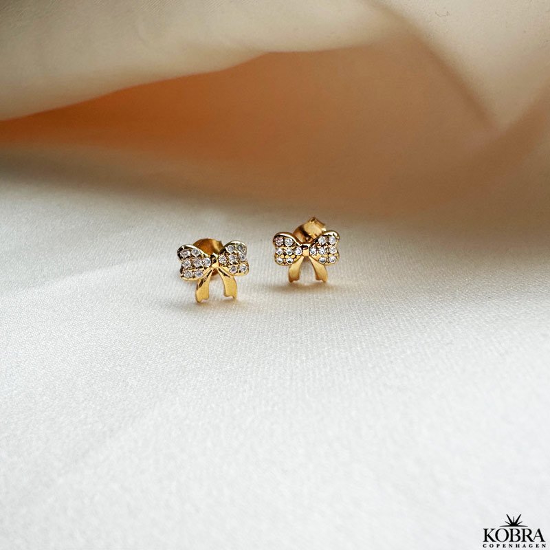 "Elsa" gold earrings with small bows and white stones