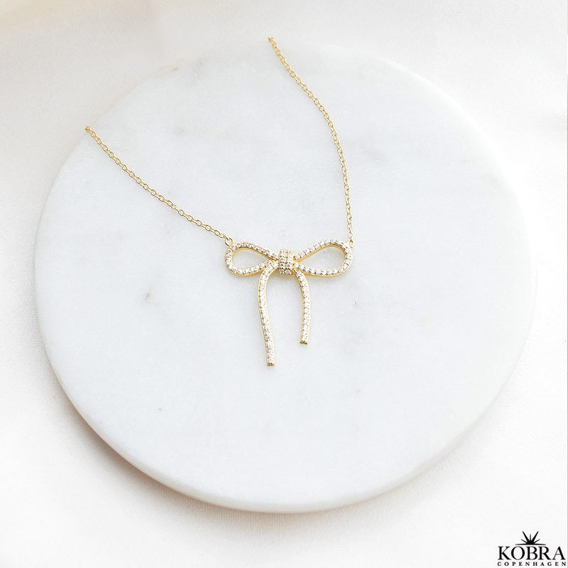 "Leonora" 18k gold plated bow necklace with stones