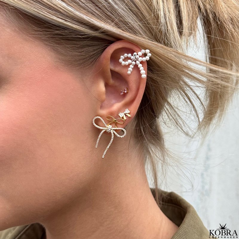 "Elsa" gold earrings with small bows and white stones