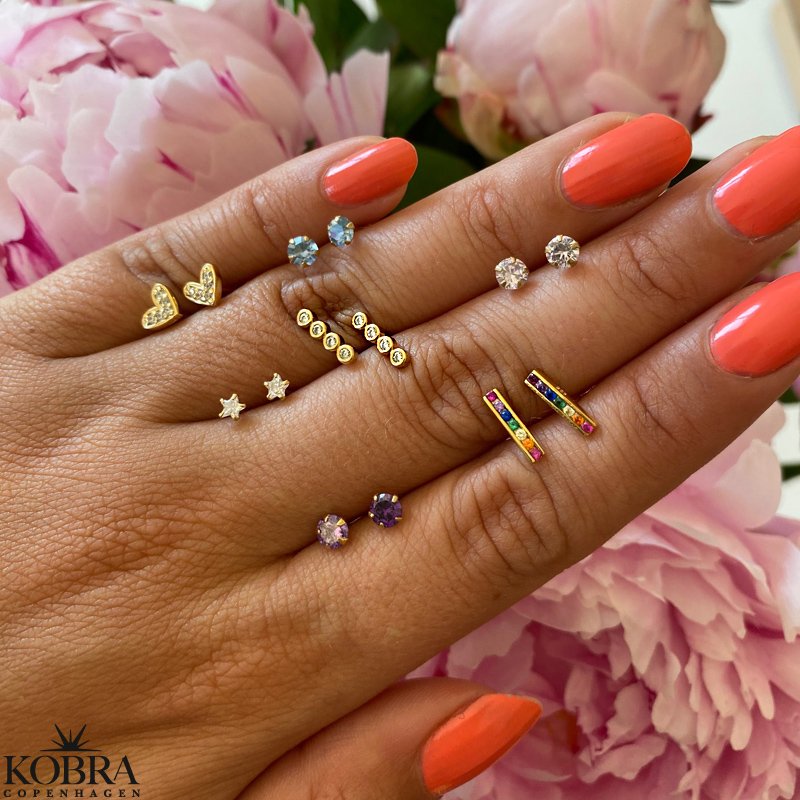 "Lupo" guld reringe med sm hvide sten