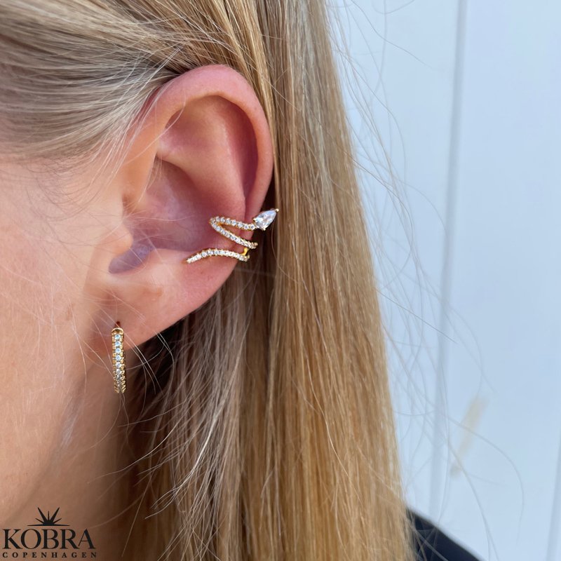 "Snakey" guld ear cuff med hvide sten