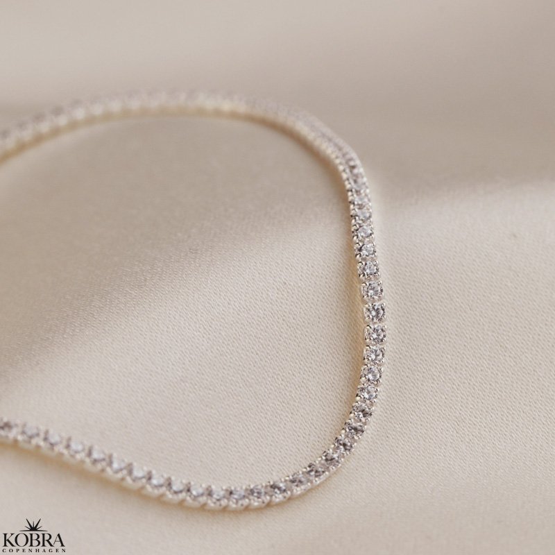 "Ivy" tennis ankelkde i slv med sten