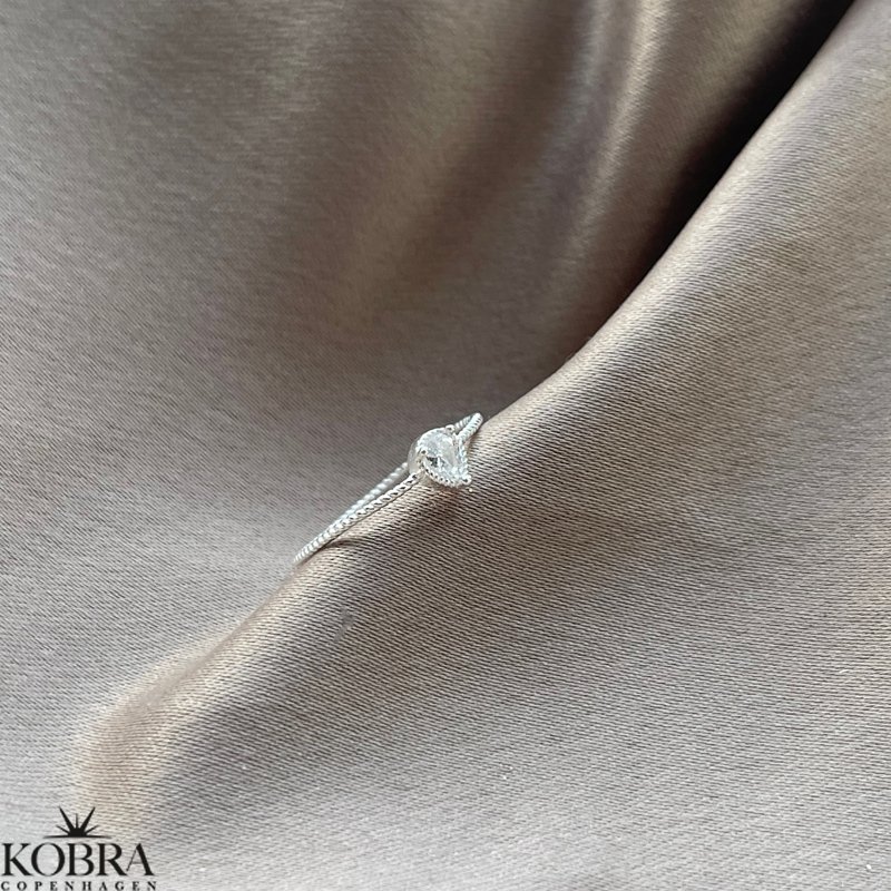 "Tillies" silver ring with drop-shaped white stone