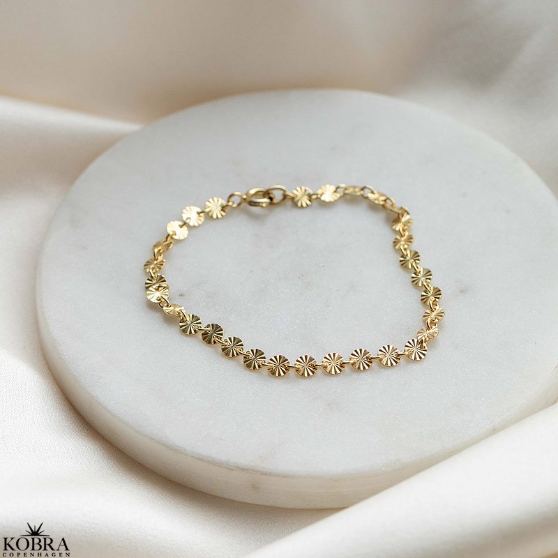 "SOL" guld armbnd med sm guld sole