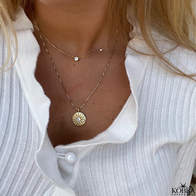 "Torino" gold-plated necklace which symbolizes the sun