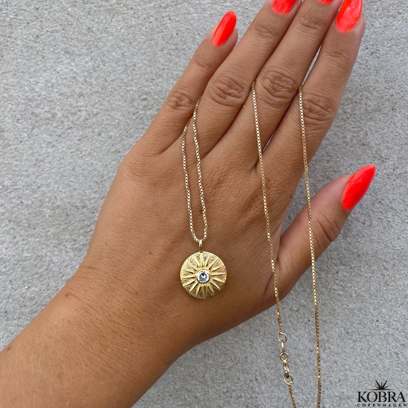 "Torino" gold-plated necklace which symbolizes the sun