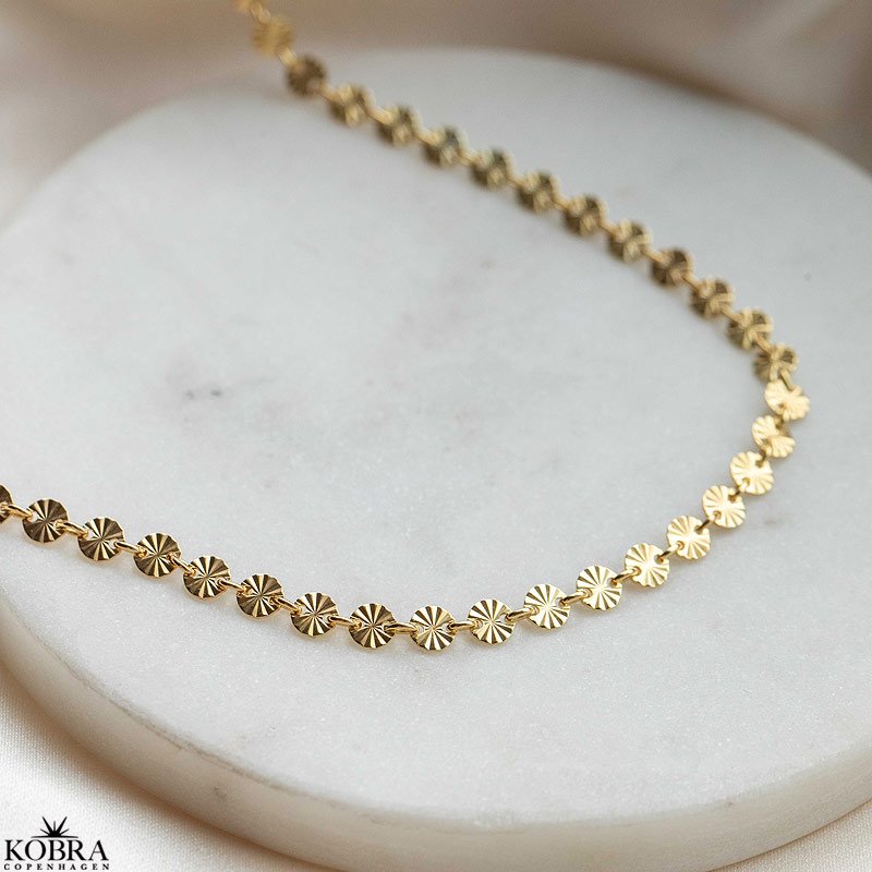 "SOL" gold necklace with small suns