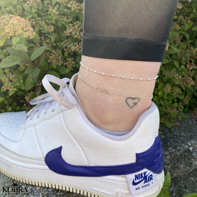 "Infinity" slv ankelkde med uendeligheds-symbol