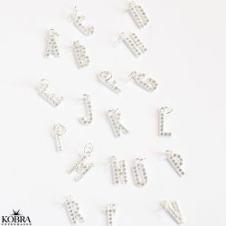 "Alias" silver letter with white stones (charm)