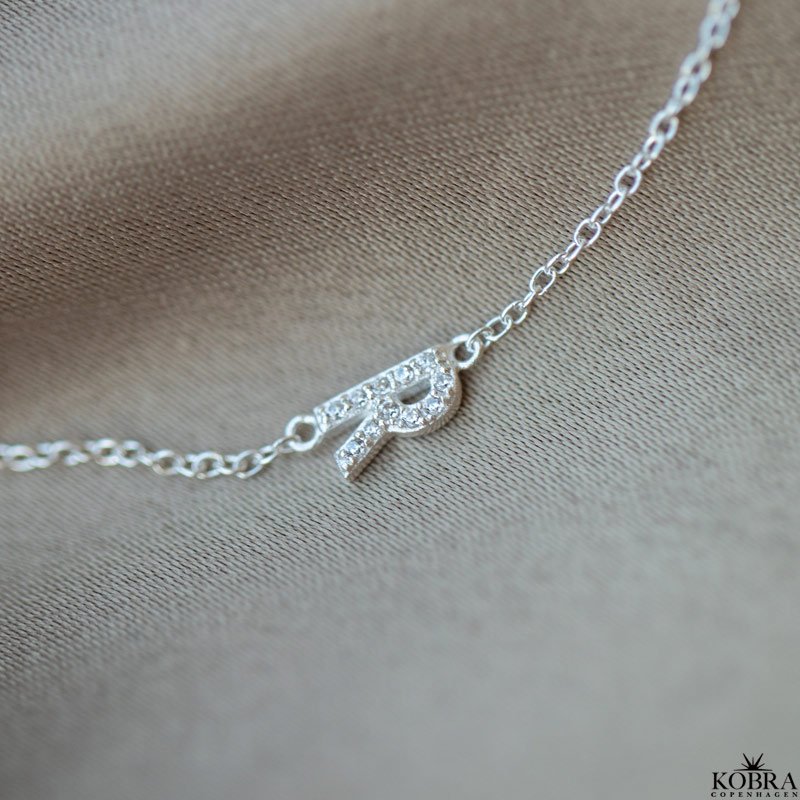 "Alias" silver bracelet with silver letter