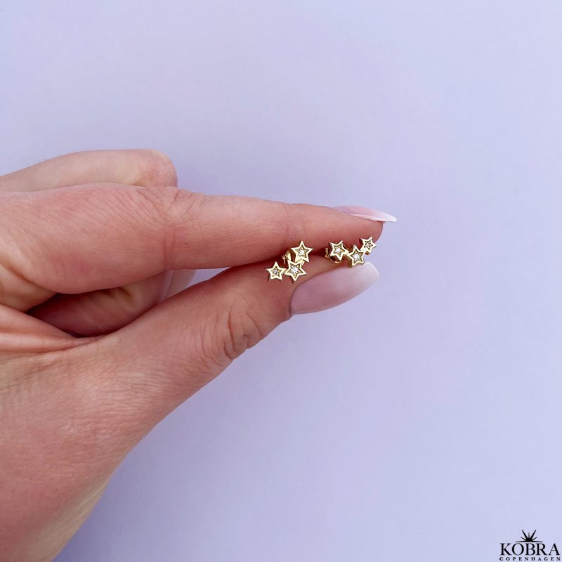 "Reeva" stjernereringe med sten i guld