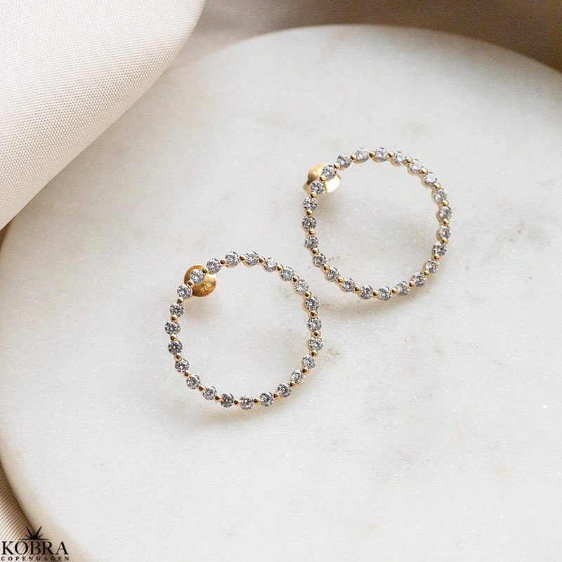 "Janet" guld restikker med hvide zirkonia sten