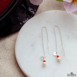 "Elina" slv retrde til Studenten med rde og hvide perler