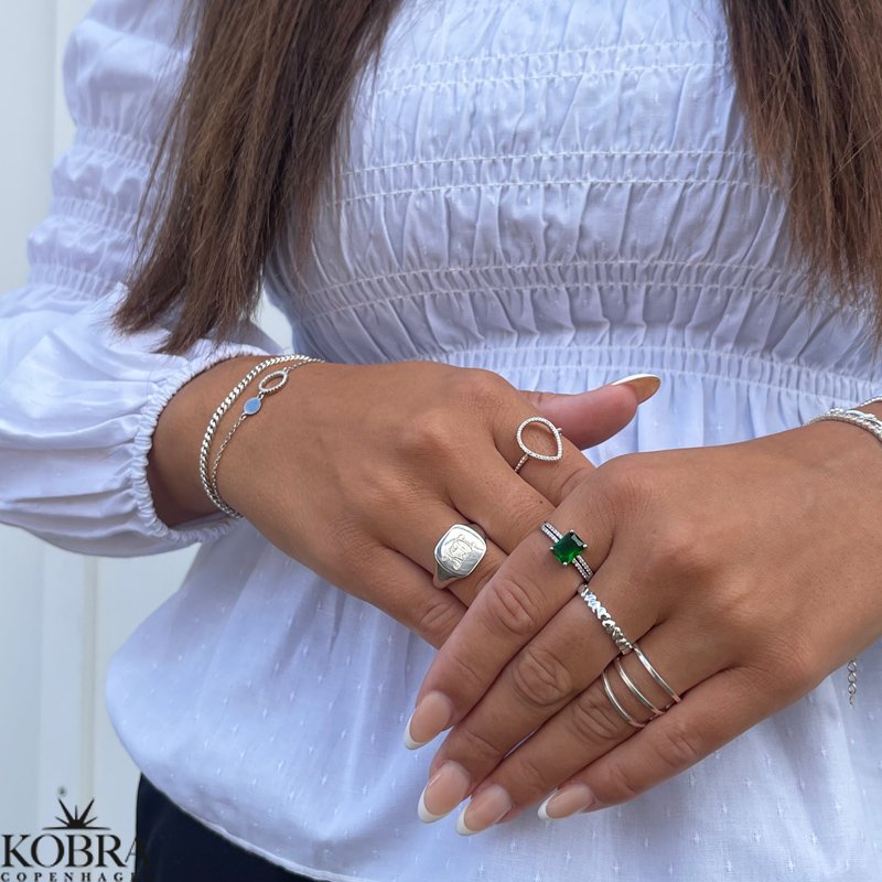 "Kaitlyn" silver ring with small hearts and a white stone
