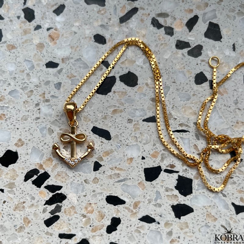 "Abira" gold plated anchor necklace with infinity and white stones
