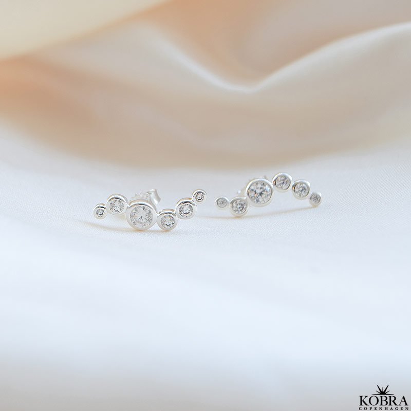 "Solenne" wavy slv reringe med sten